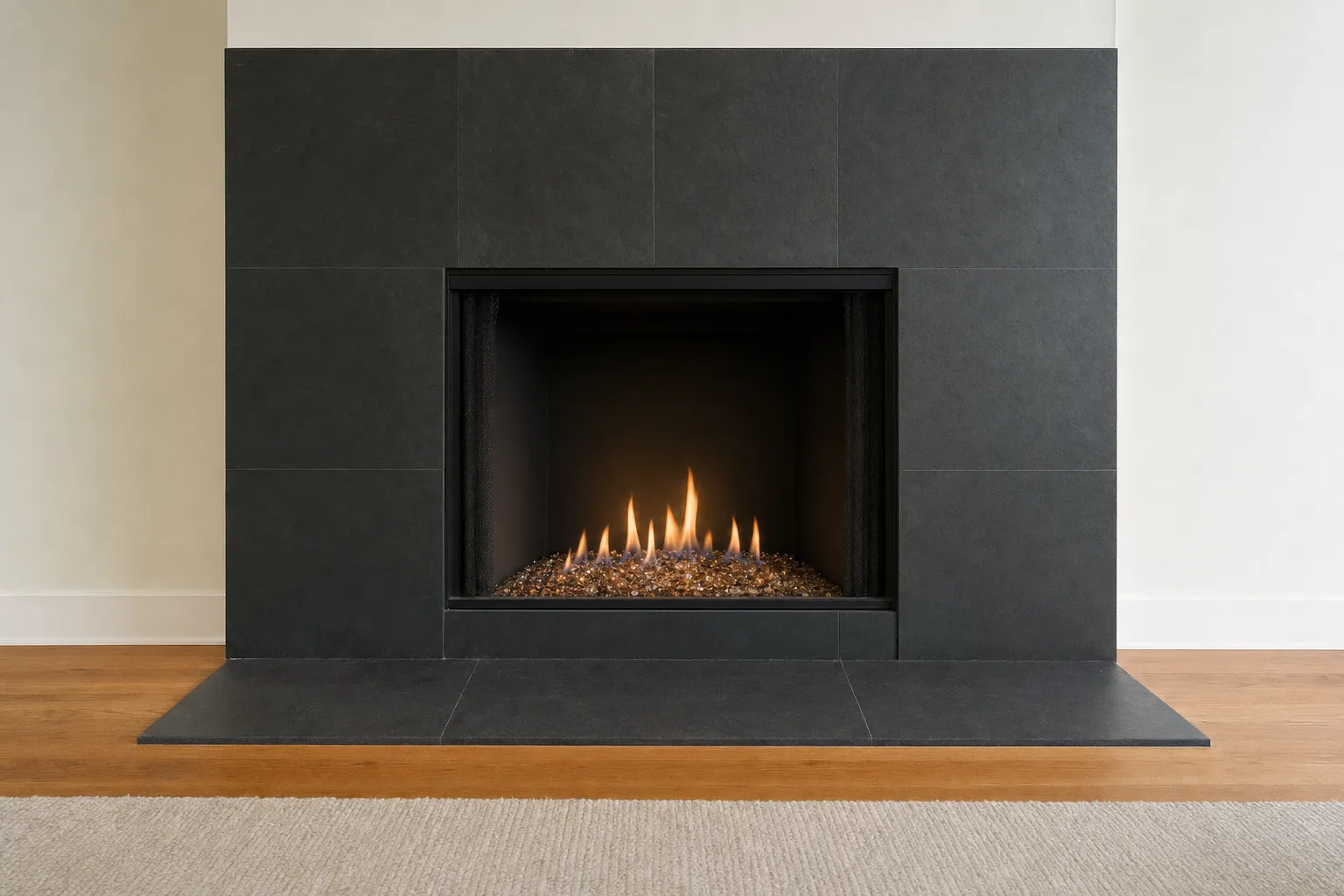 Design visualization, after: a fireplace with a dark slate surround with clear and amber fire glass under a low, even flame in a black firebox
