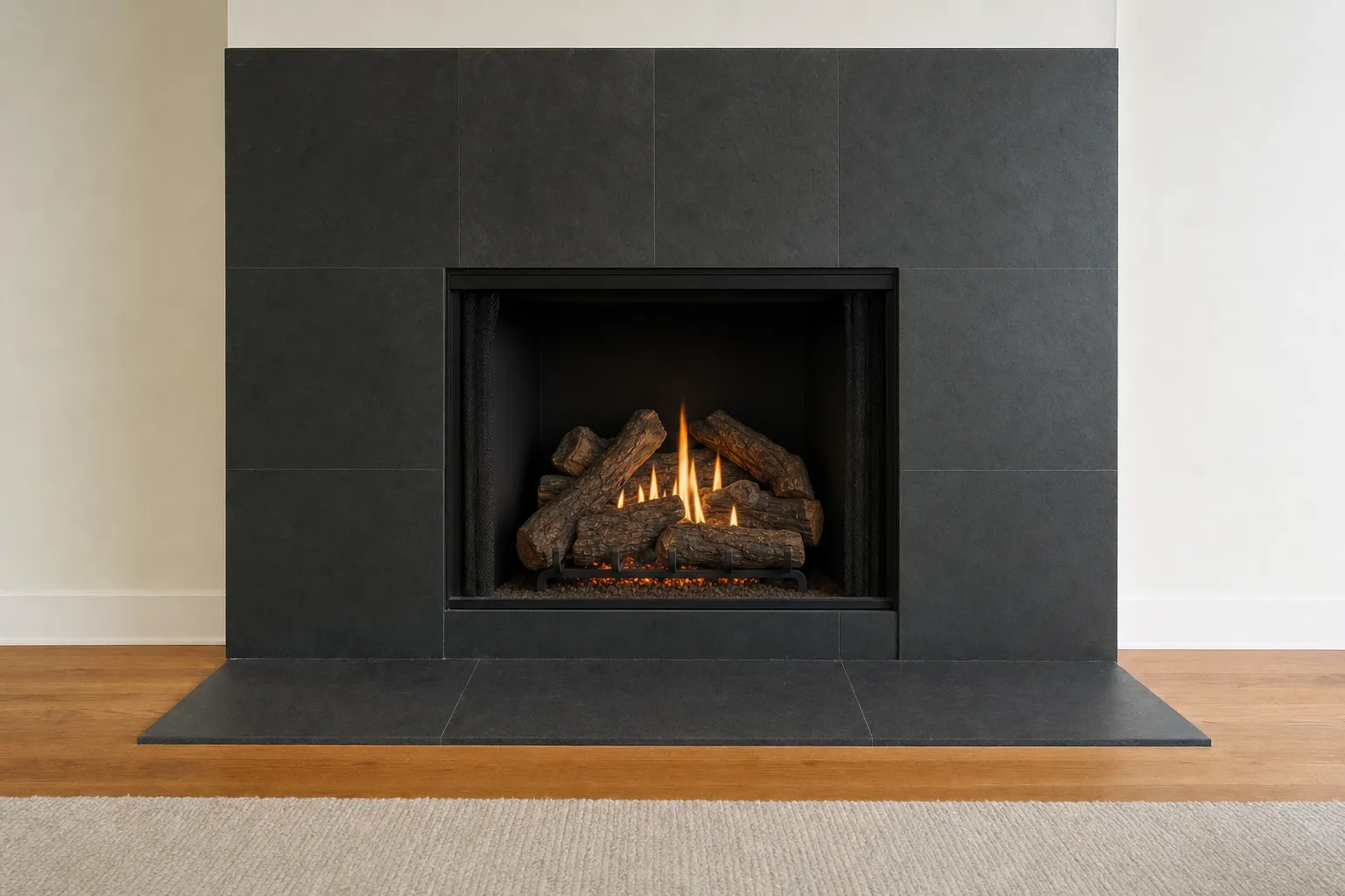 Design visualization, after: a fireplace with a dark slate surround with premium realistic oak-style gas logs over a subtle ember bed