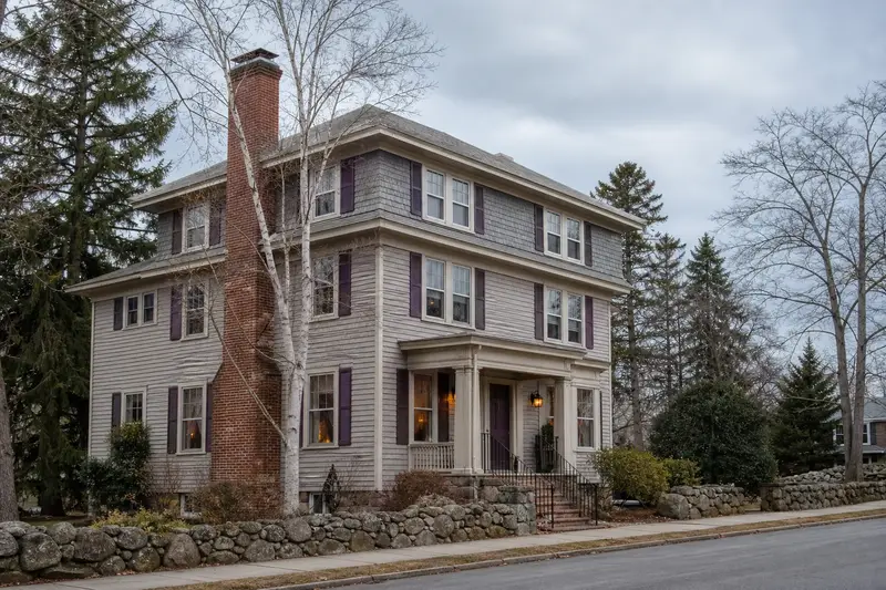 A 1950s triple-decker house with a stone masonry chimney of even red brick; illustrative image