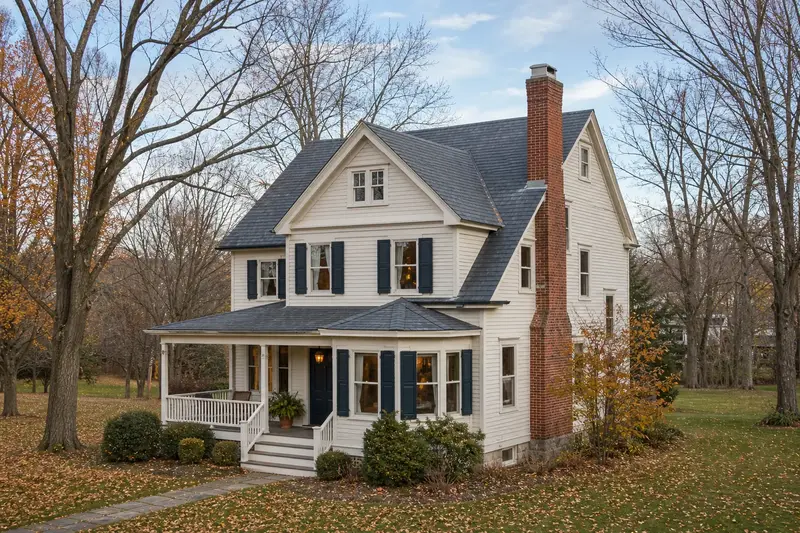 A 1930s Victorian frame house with a red brick chimney with a concrete crown and neat mortar joints; illustrative image