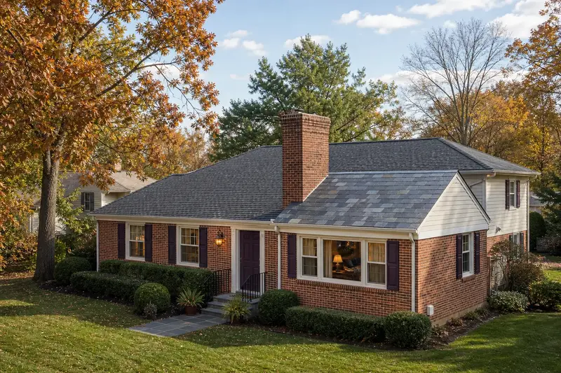 A 1980s brick rambler in soft daylight with a brick chimney with corbelled top courses standing clear above the roofline; illustrative image