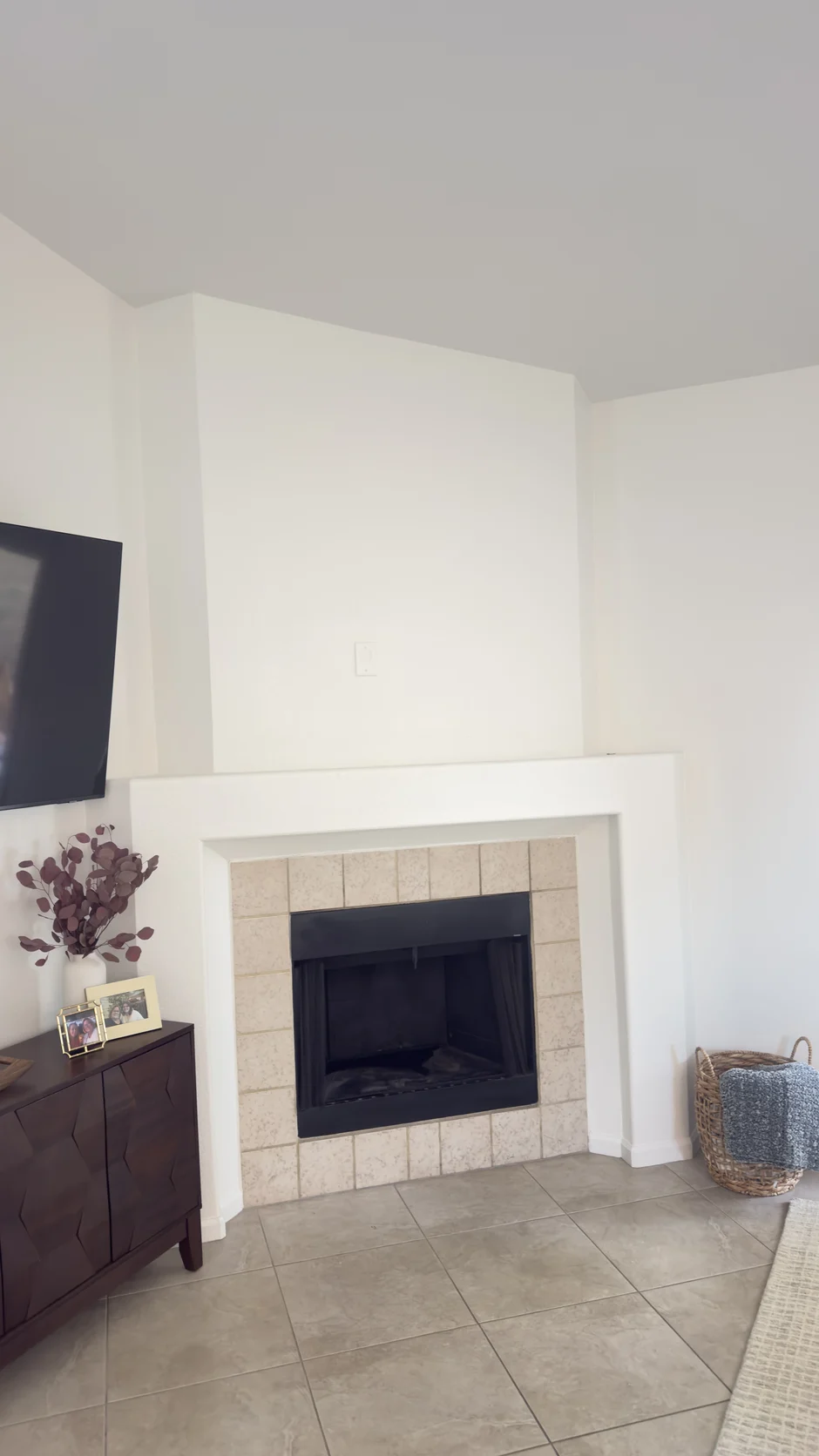 White corner fireplace in an empty room