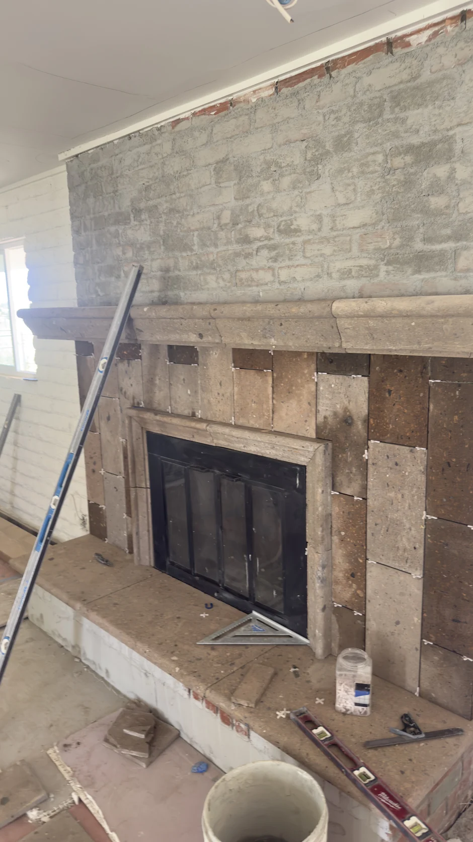 Fireplace surround with tile work in progress