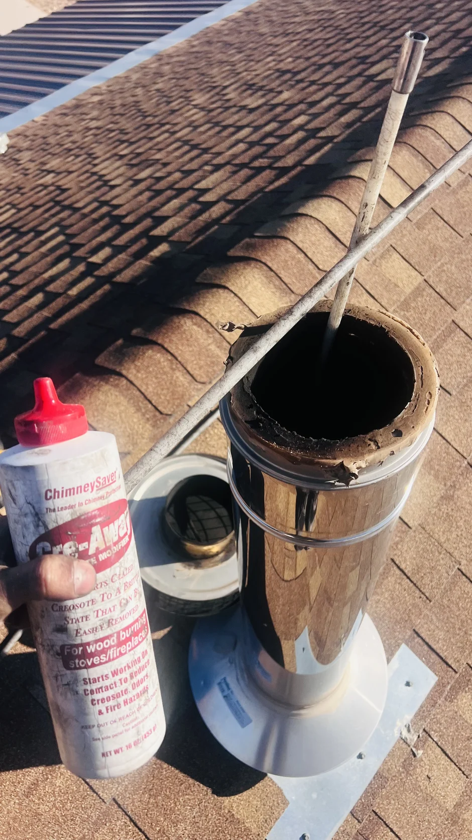 Stainless liner sections and sealant on a rooftop