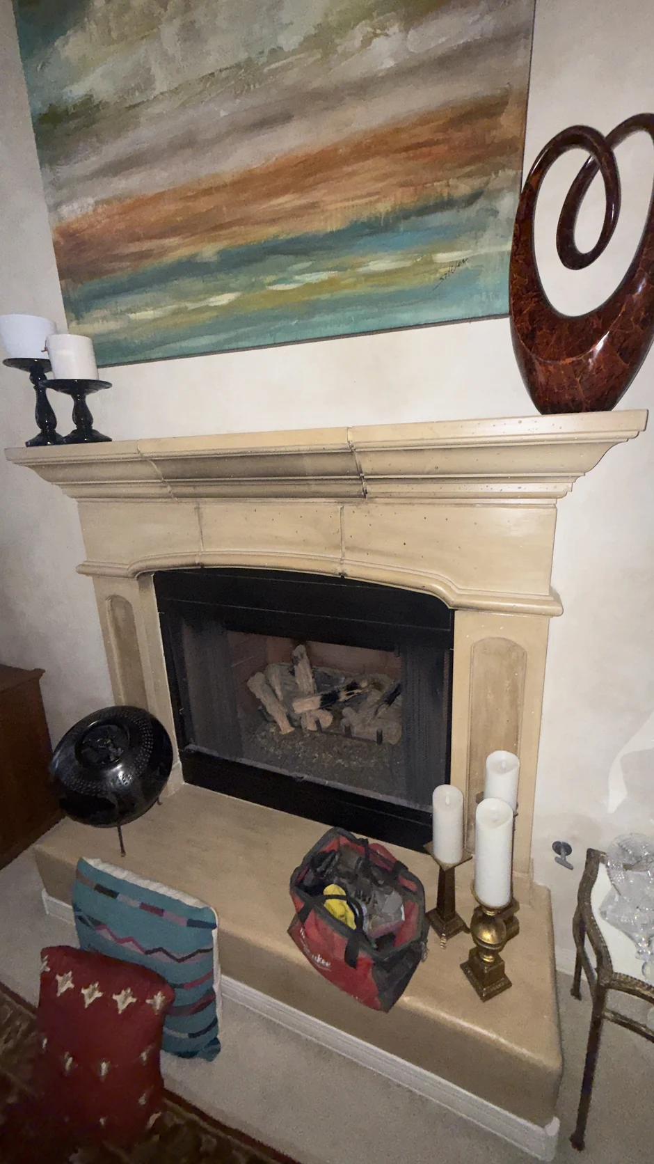 Mantel shelf with decor above a fireplace