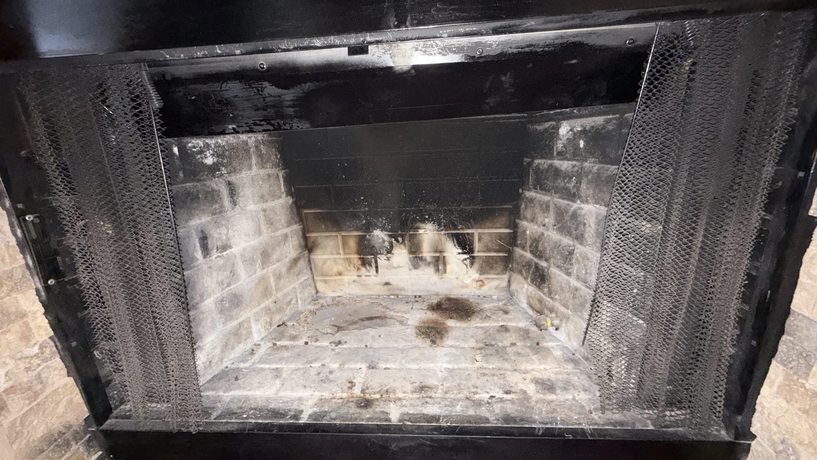 Soot-blackened metal firebox interior