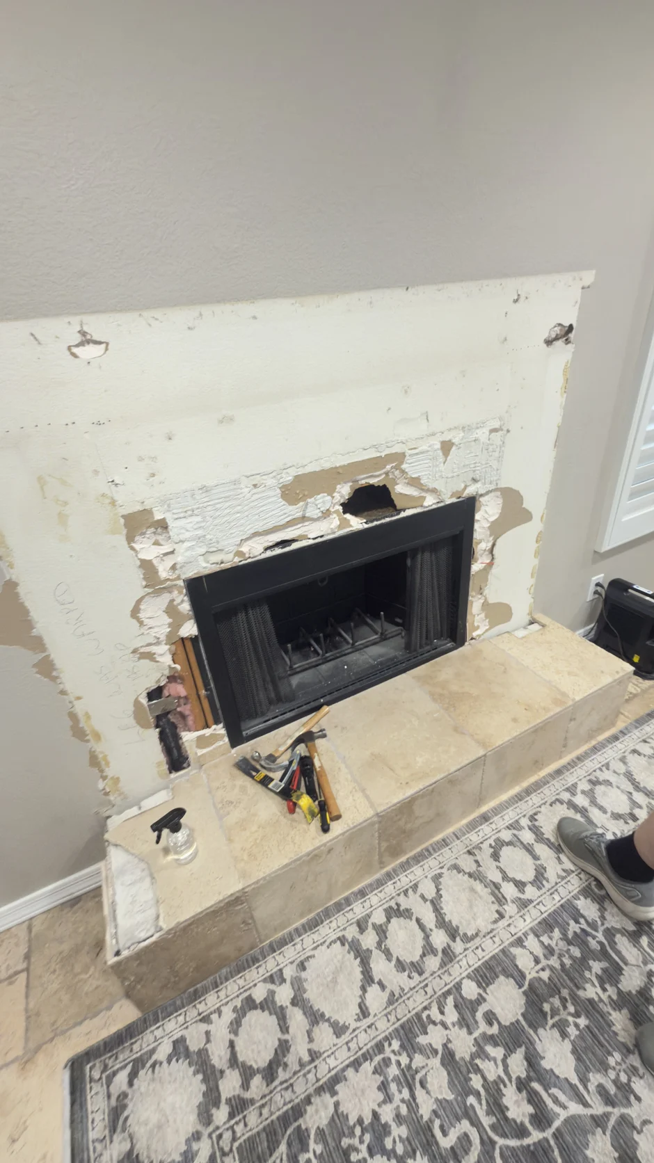 Fireplace surround during demolition with floor protection