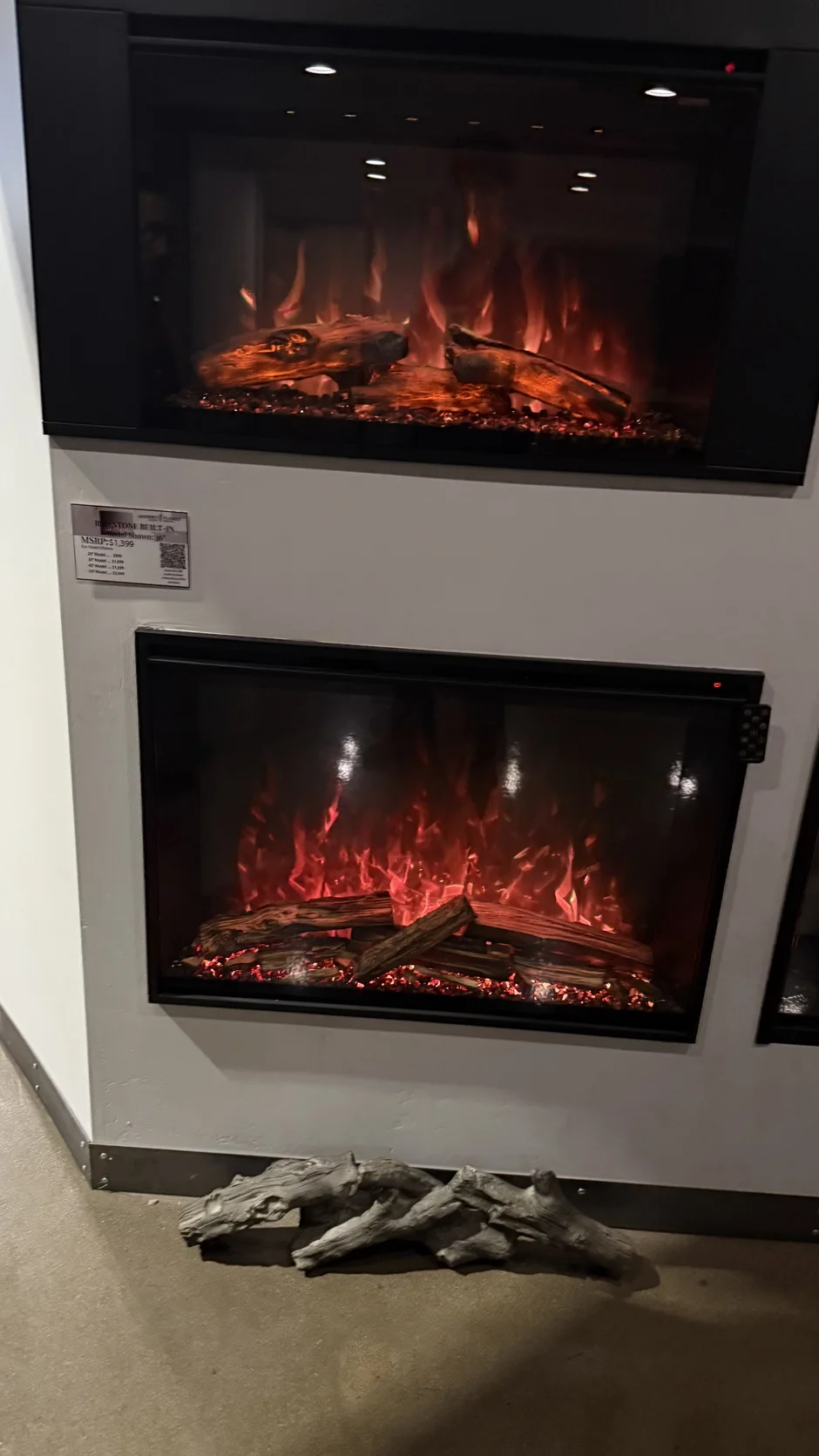 Fireplace insert in a white plaster surround